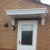 The Dunster Flat Smooth GRP Over Door Canopy with Fully Moulded Brackets Attached
