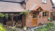 The Cheltenham Dual Pitched Tiled Over Door Canopy includes 2x Brackets